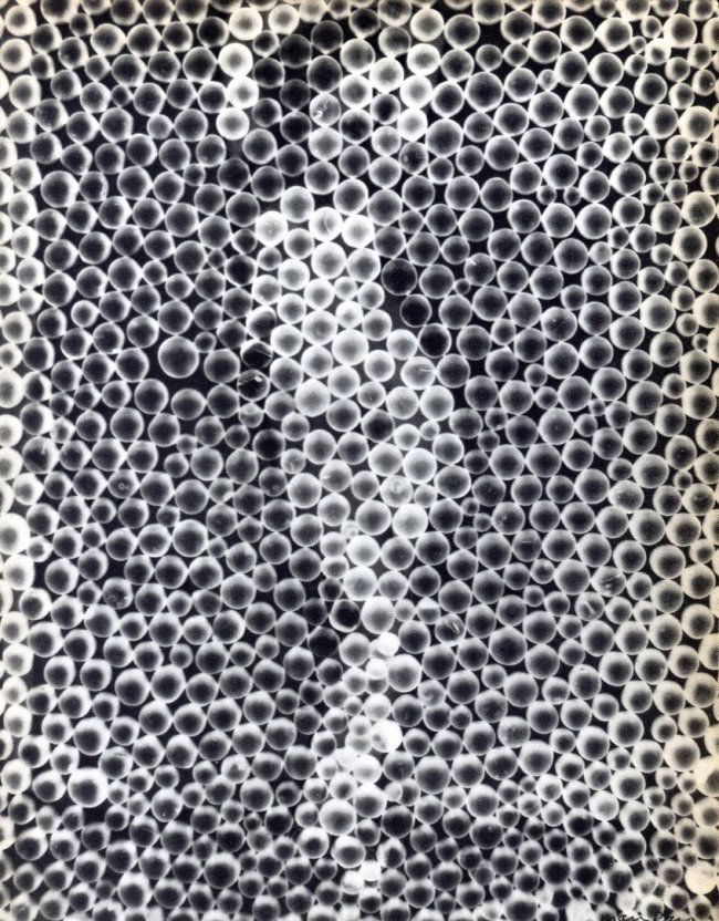 Man Ray: Abstract Nude: Print Title: Abstract Nude Artist: Man Ray Printing Date: 1934 Medium: Vintage Sheet-fed Gravure Printer: La Neogravure, France Image Size: 8 x 10.5 inches Man Ray, original name Emmanuel Radnitzky, w