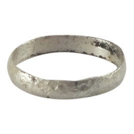Viking Woman’s Wedding Ring 850-1050 A.D.: Jewelry: Viking Woman’s Wedding Ring Date: 850-1050 A.D. Size: 3.75 Material: Silver overlay For wear on the small finger as was the custom. Narrow band with rounded face. Vikings exchanged rings on