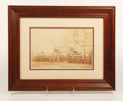 An original photograph by Court Photographer Hahn: An original Russian photograph by Court Photographer C.E. Hahn depicting a group of senior Imperial Army officers in uniform before a church and greeting a member of the Imperial family, possibly Nich