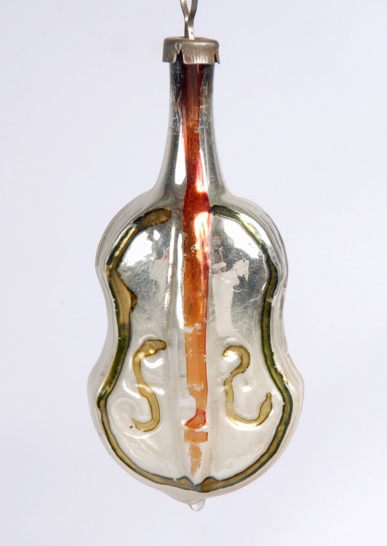 Violin Hand Blown Christmas Ornament, c 1930: Item: Antique Violin Shaped Christmas Ornament Date: Circa 1930 Material: Hand blown glass Dimensions: 3 inches high x 1.5 inches wide Please note that this lot has a reserve. When you leave a bid in 