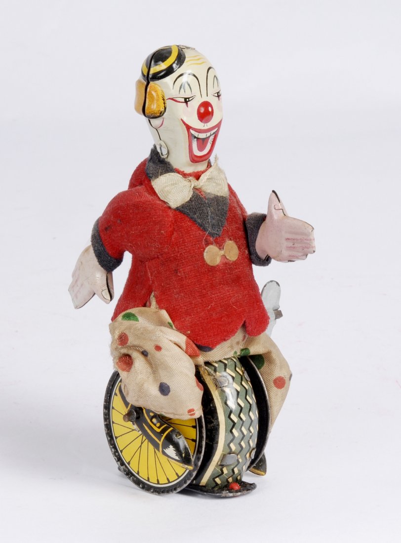 Clown on Unicycle Tin Litho Wind Up Toy, c 1950