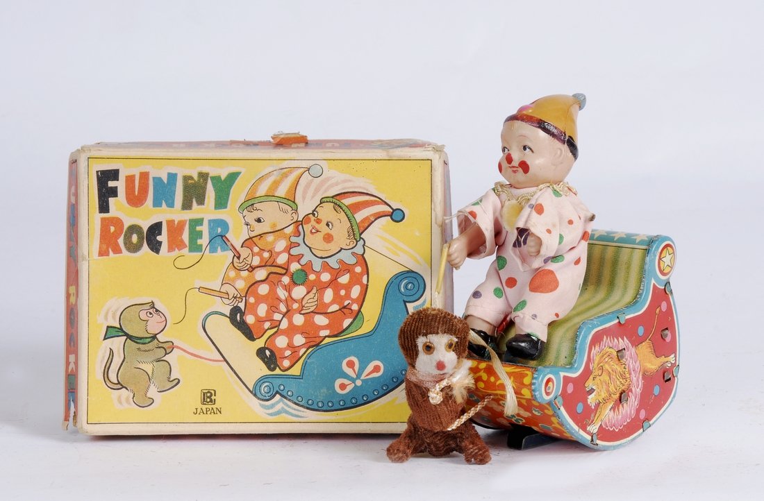 Funny Rocker Pull to Action Toy, c 1950: Item: Funny Rocker Pull to Action Toy Date: Circa 1950 Description: Funny rocker pull to action toy with clown & monkey on a tin litho sleigh. Pull the monkey out on his leash and the sleigh starts ro