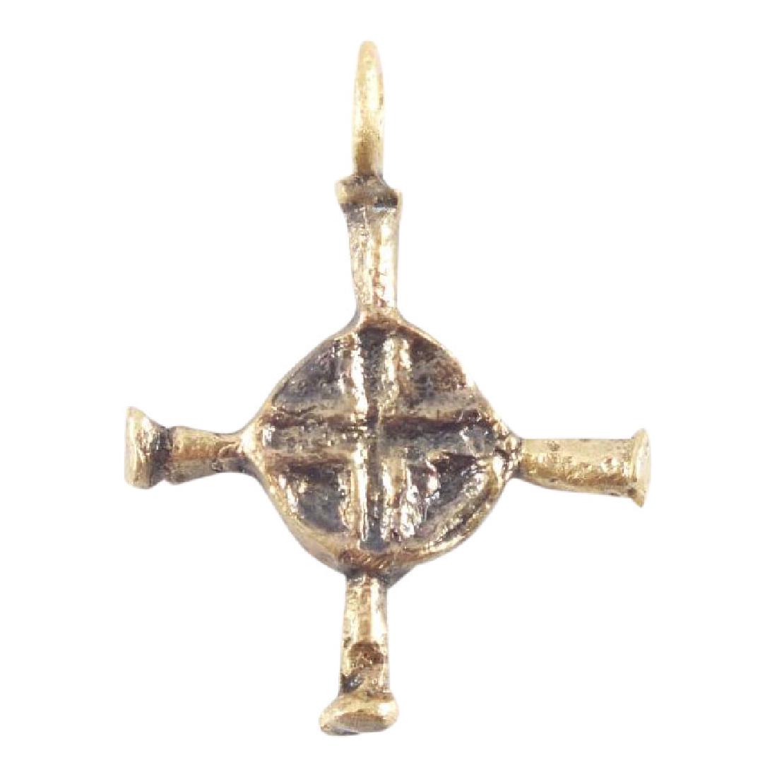 Medieval Christian Cross 11th-12h Century: Jewelry: Medieval Christian Cross Date: 11th-12h Century Material: Gilt bronze Size: Just over 3/4 inches tall Early Gothic form Symmetrical lobed terminal beams with large central circle incised with