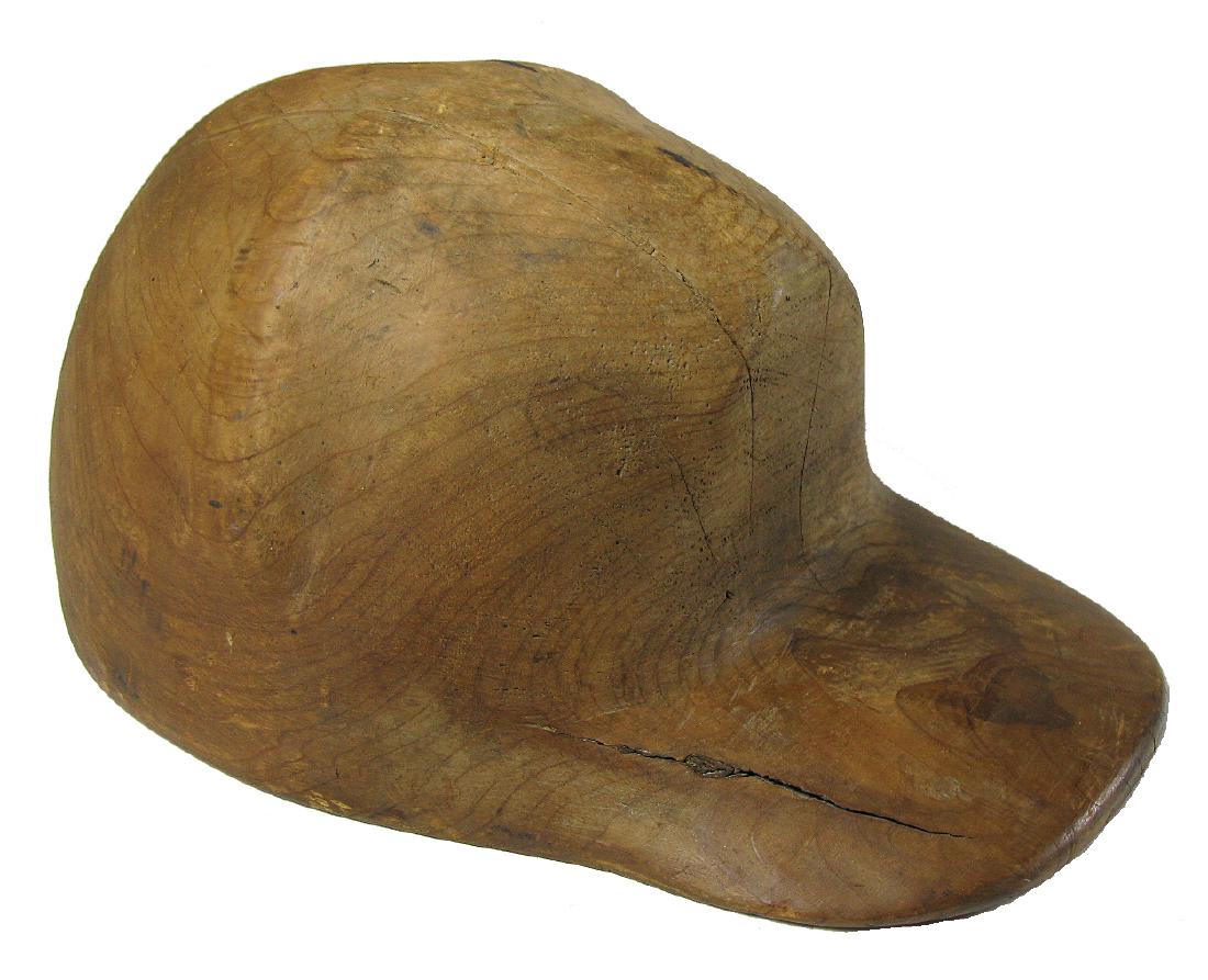 Carved Wooden Cap c 1900: Item: Carved Wooden Cap Circa: 1900 Size: 7.75 x 11 inches This is a single piece of cedar carved into a baseball-style cap with a flat brim and a headpiece sculpted with ridges that mimic fabric pane