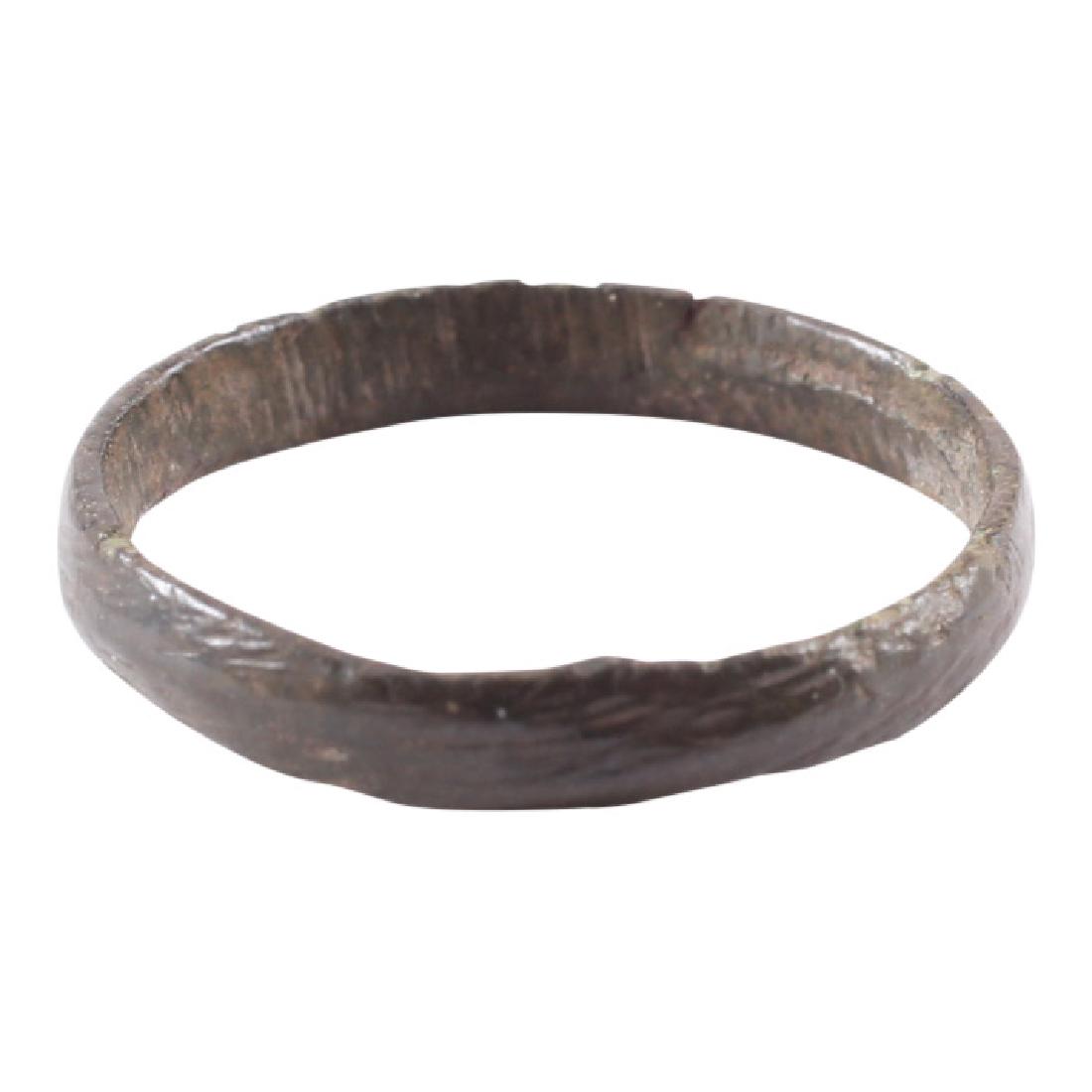 Viking Women's Wedding Ring, 850-1050: Item: Viking Women's Wedding Ring Date: 850-1050 AD Material: Bronze Size: 3.25 For wear on the small finger as was the custom. Narrow band with rounded face. Vikings exchanged rings on the pommel of