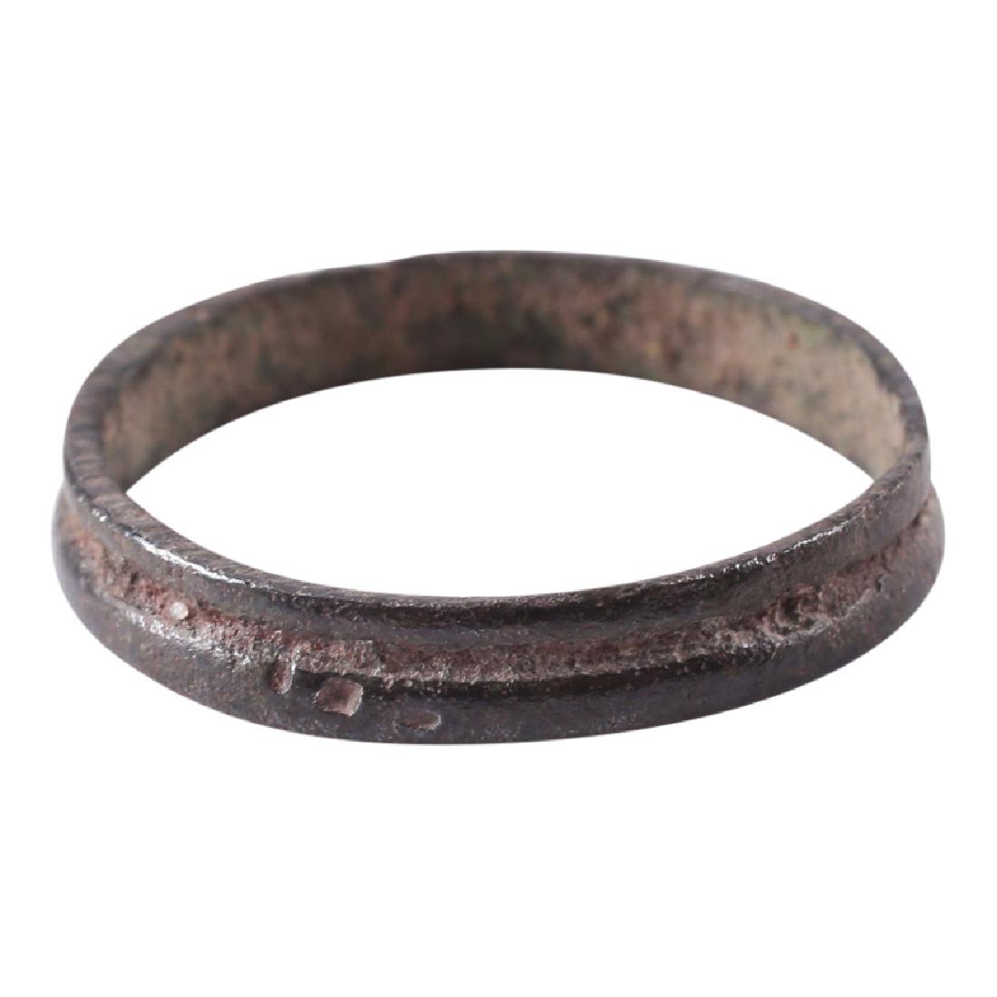 Viking Man's Wedding Ring, 850-100: Item: Viking Man's Wedding Ring Date: 850-100 AD Material: Bronze Size: 1 inch Broad band with raised edges flanking depressed medial. Vikings exchanged rings on the pommel of the groom’s sword. All