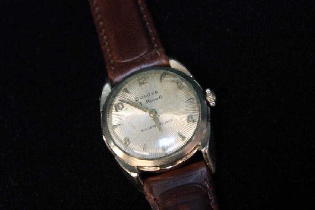 Vintage Bulova Self Winding Wrist Watch, 1956: Watch: Vintage Bulova 23 Jewels Self Winding Wrist Watch with brown leather band Date: Circa 1956 Condition: Running, timed. Crystal has a crack above the 2, not distracting Brand: Bulova Movement: 23