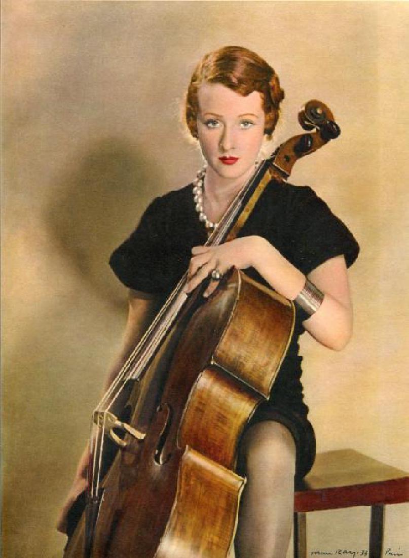 Man Ray: Femme avec Violoncelle: Print: Femme avec Violoncelle Artist: Man Ray Size: 8 x 11 inches Vintage Sheet-Fed Color Gravure printed in 1933 by La Neogravure, France, signed in plate. Please note that this lot has a reserve. Wh