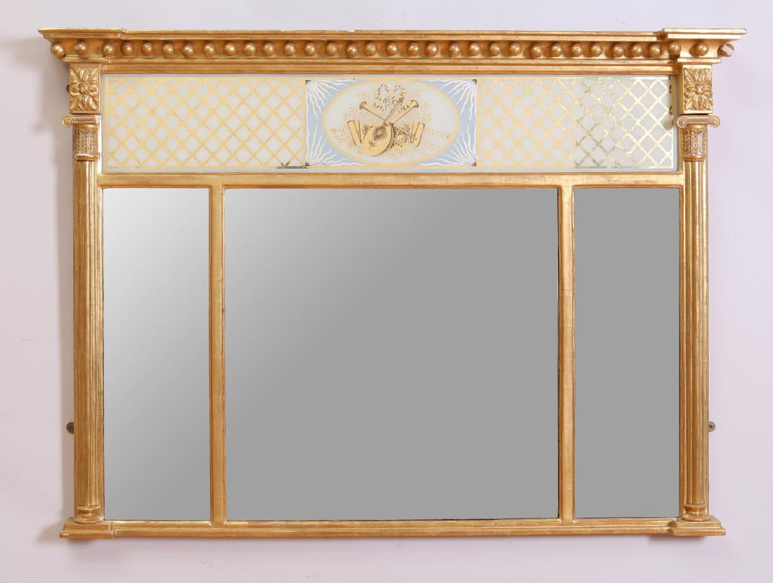 Regency Verre Églomisé and Giltwood Overmantle Mirror: Regency Verre Églomisé and Giltwood Overmantle Mirror Fitted with a verre églomisé panel at the top, above three divided mirror plates. 37 1/2 x 4 ft. 3 1/4 in.