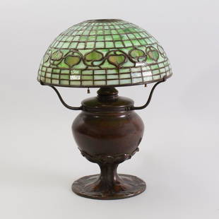 Tiffany Studios 'Acorn' Table Lamp: Tiffany Studios 'Acorn' Table Lamp Leaded glass and patinated bronze, shade with tag impressed 'Tiffany Studios/New York', the base with impressed mark, very rubbed, and numbered '29938'. The shade 5