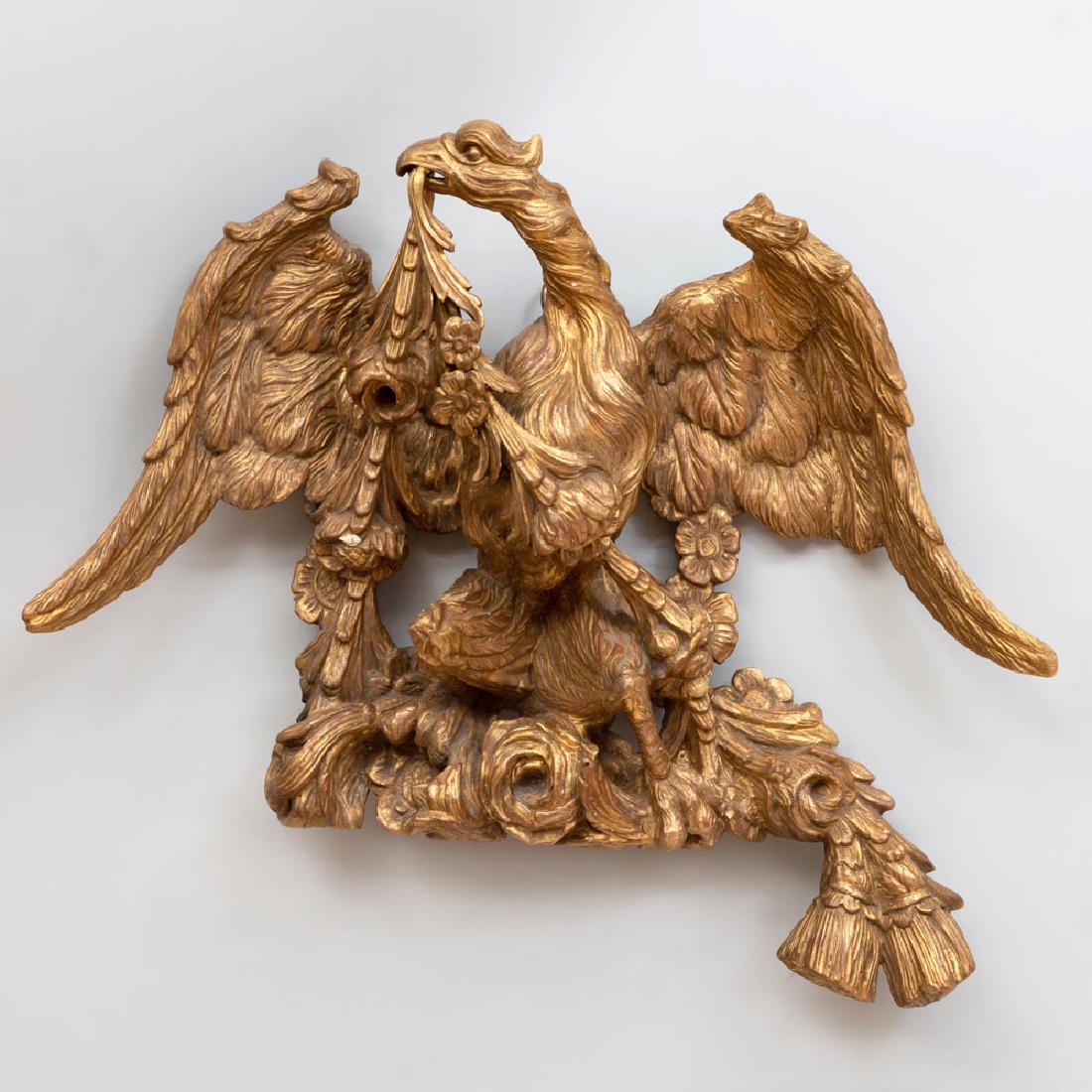 Continental Carved Giltwood Eagle with Tassels: Continental Carved Giltwood Eagle with Tassels 20 x 23 in. Property from the Collection of Melinda and Paul Sullivan, Eyrie Knoll, West Hartford, Connecticut