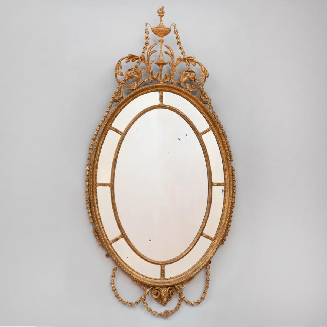 Fine George III Giltwood and Gilt-Gesso Oval Mirror: Fine George III Giltwood and Gilt-Gesso Oval Mirror 68 x 33 1/4 in. Property from the Repository of a Distinguished Businessman