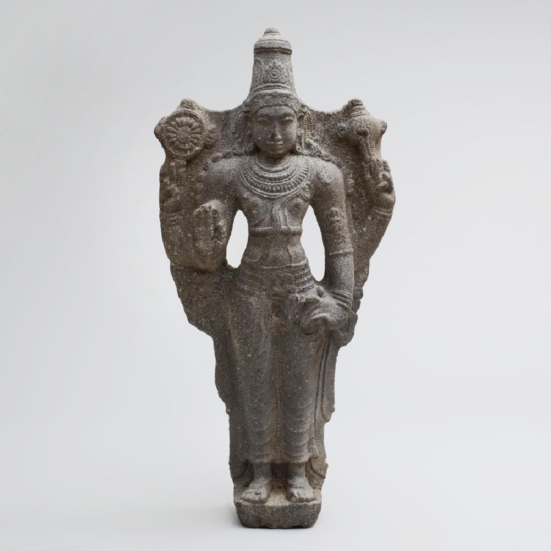 Fine Indian Grey Granite Figure of Vishnu: 48 x 23 x 8 1/2 in. Note: Vishnu is part of the trimurti (or trinity) which is the triple deity of supreme divinity in Hinduism. The trimurti is represented by Brahma, the creator; Vishnu, the preserv