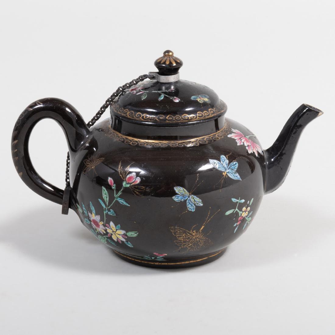 Staffordshire Pottery Black Ground Teapot and Cover: Staffordshire Pottery Black Ground Teapot and Cover 7 in. wide (over handle). Applied label for Vera Elkind Collection, inv. # B105.