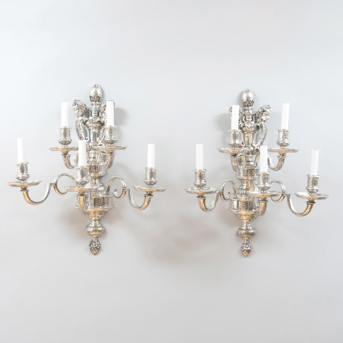 Pair of Silver Plated Five-Light Wall Sconces with: Pair of Silver Plated Five-Light Wall Sconces with Cherub Form Terminals 13 1/2 x 20 x 13 in.
