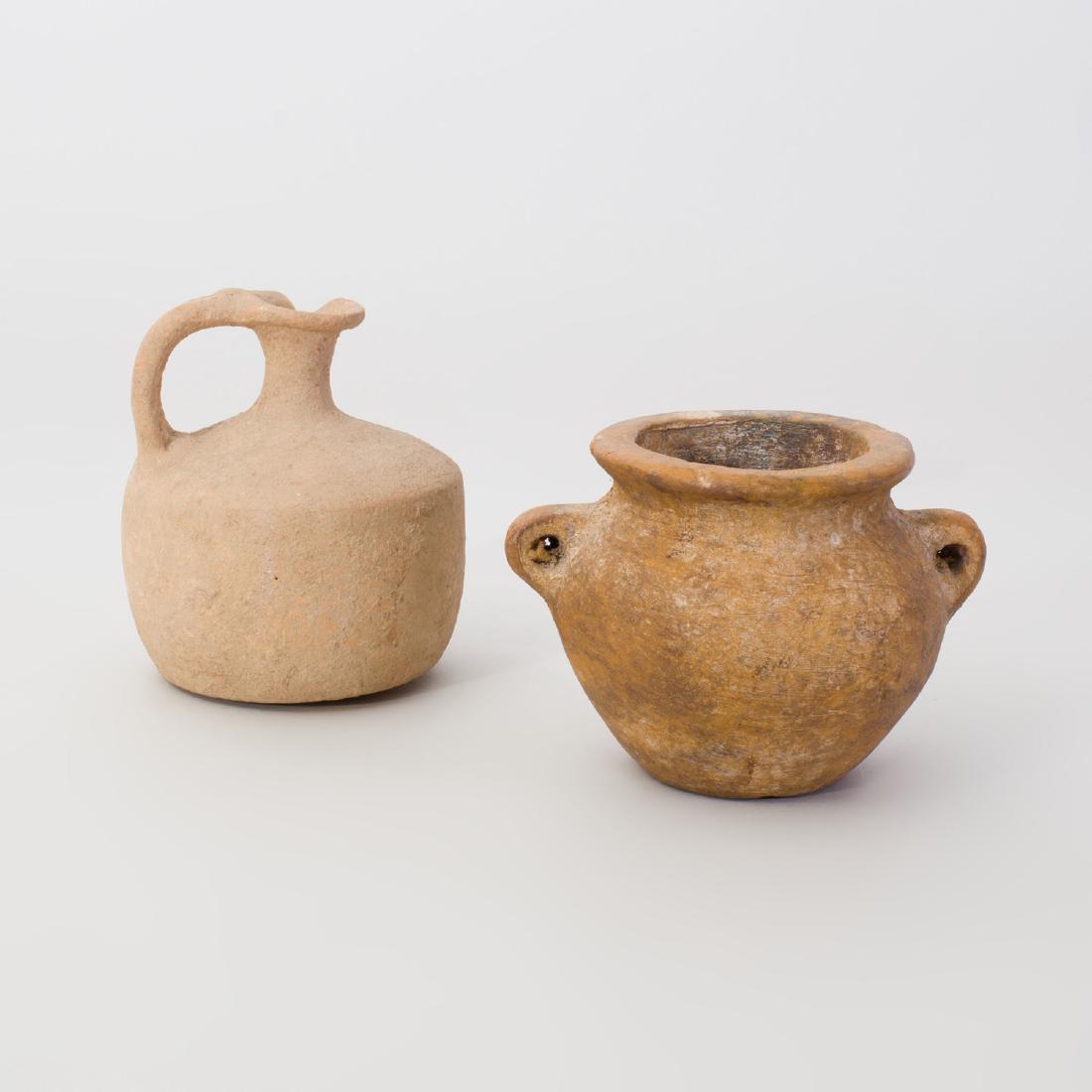 Red Painted Pottery Two Handled Vase and a Pottery Ewer: Red Painted Pottery Two Handled Vase and a Pottery Ewer The vase 4 1/2 x 5 1/4 in. diam., the ewer 5 1/2 x 4 3/4 in. Property from the Collection of Morley & Jane Safer
