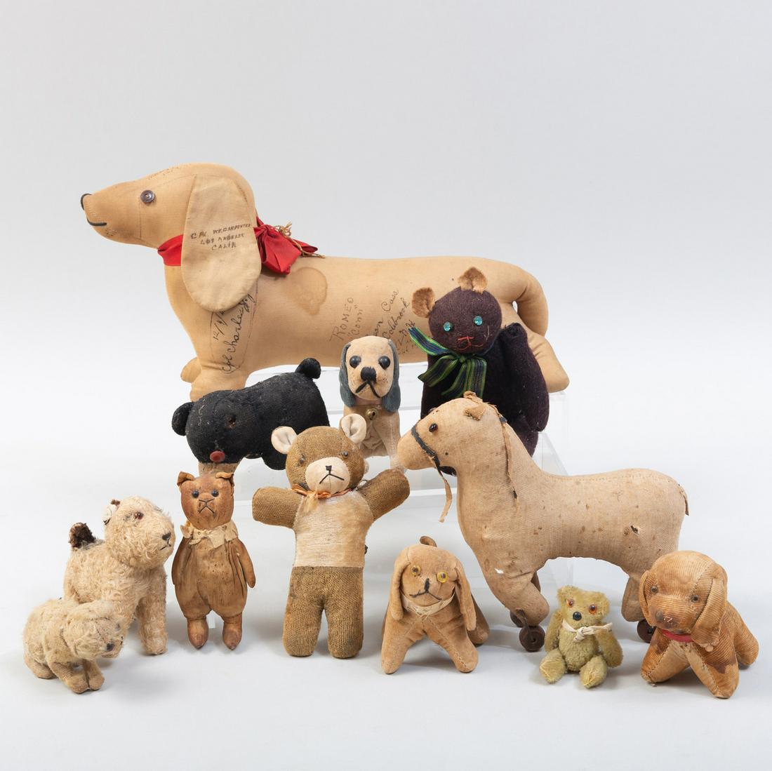 Group of Eleven Plush Animals: Group of Eleven Plush Animals Comprising: Five dogs Five teddy bears A hobby horse The largest 15 in. long. The Estate of Philip and Kathleen Seibel, Catskill, NY
