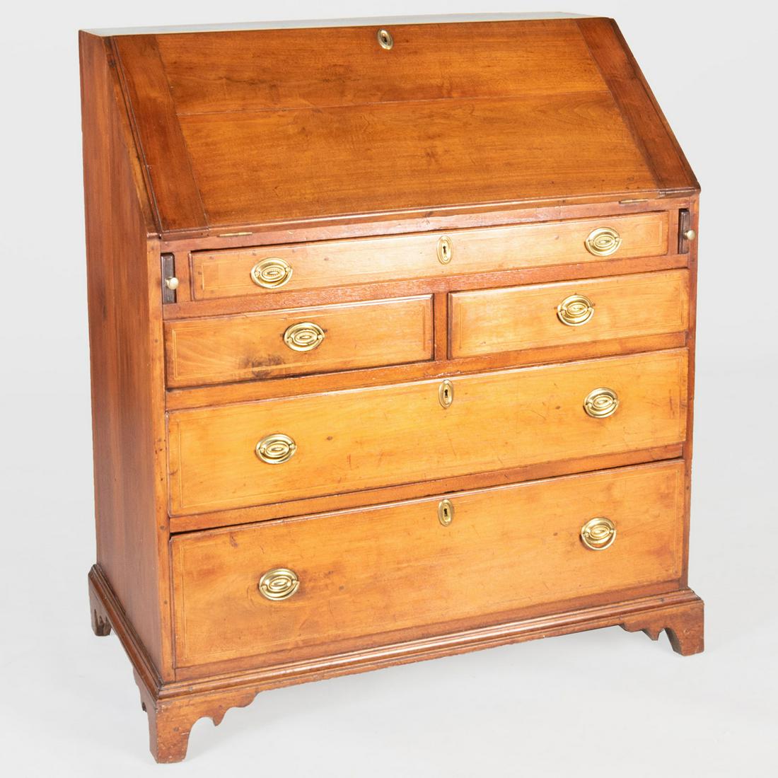 George III Provincial Mahogany Slant Front Desk: George III Provincial Mahogany Slant Front Desk With a paper label on the back 'Cheyney Shop Antiques, Cheyney, PA'. 45 x 39 1/2 x 22 1/4 in.
