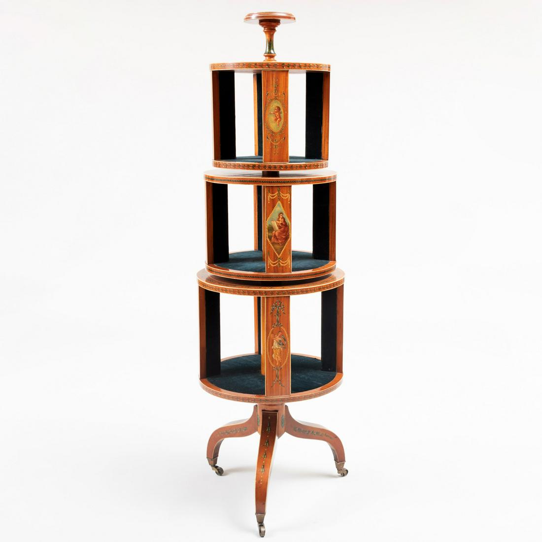 Edwardian Style Painted Satinwood Three-Tiered: Edwardian Style Painted Satinwood Three-Tiered Revolving Bookstand, in the manner of Angelica Kauffman Each tier fitted with blue velvet lining. 59 1/2 x 17 1/2 x 17 1/2 in.