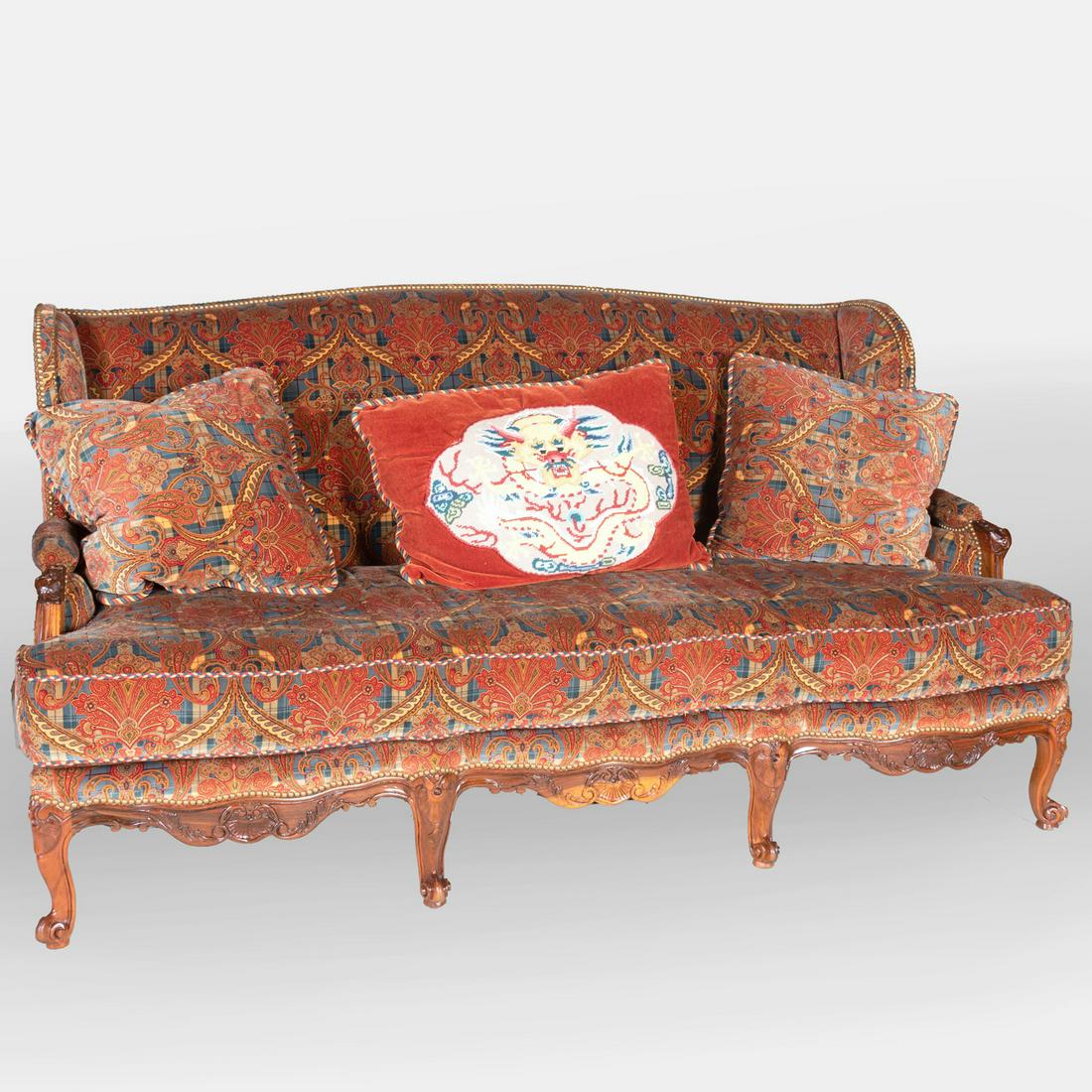 Régence Style Fruitwood Upholstered Canapé à L'Oreille: Régence Style Fruitwood Upholstered Canapé à L'Oreille Upholstered in a tartan paisley fabric, together with a chinoiserie needlework pillow and a pair of tartan paisley pillows. 44 x 79 x 33 3/4