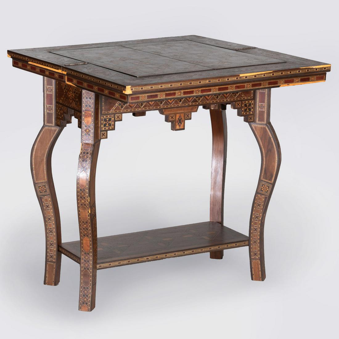 Moroccan Mother-of-Pearl Inlaid Exotic Wood Games Table: Moroccan Mother-of-Pearl Inlaid Exotic Wood Games Table The hinged top opening to a backgammon board with an inset chess board reversing to a velvet lined surface, above the welled interior, raised on