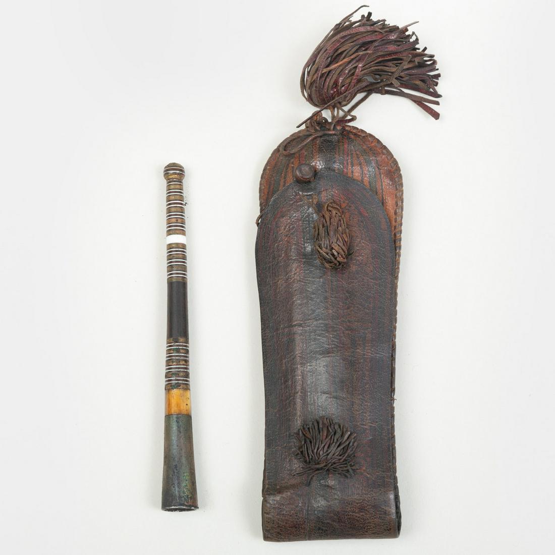 Tuareg Painted Leather Pouch, Niger: Tuareg Painted Leather Pouch, Niger Or possibly Mauritania (Moor), together with a Painted Metal Pipe. 7 x 2 in. Note: A nearly identical Tuareg leather pouch with pipe is illustrated in Marc Ginzberg