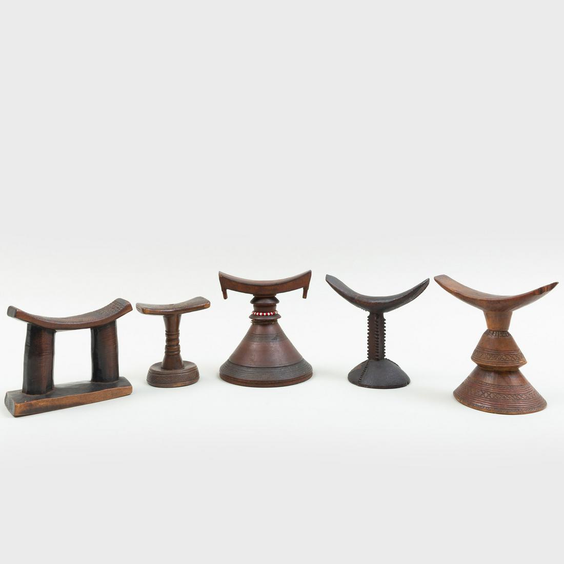 Group of Five African Wooden Headrests: Group of Five African Wooden Headrests Including examples from Guinea, Biojogo culture; Democratic Republic of the Congo, Lele culture; Ethiopian and Central Africa, all with geometric decoration, the