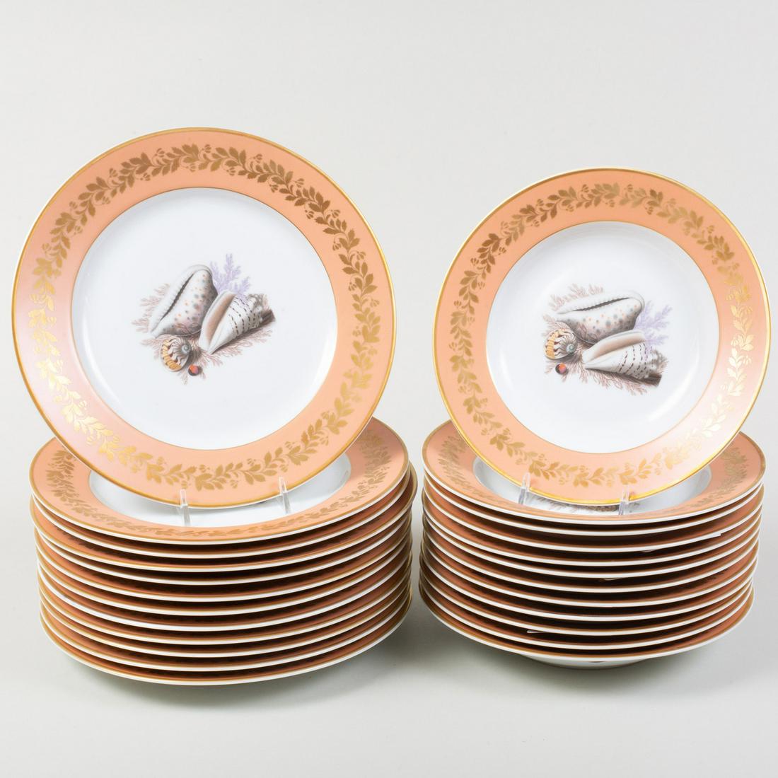 Mottahedeh Porcelain Peach Ground Part Service, in the: Mottahedeh Porcelain Peach Ground Part Service, in the 'Natchez Shell' Pattern Green and brown printed mark. Comprising: Twelve dinner plates Twelve soup plates The dinner plates 10 1/8 in. diam. <