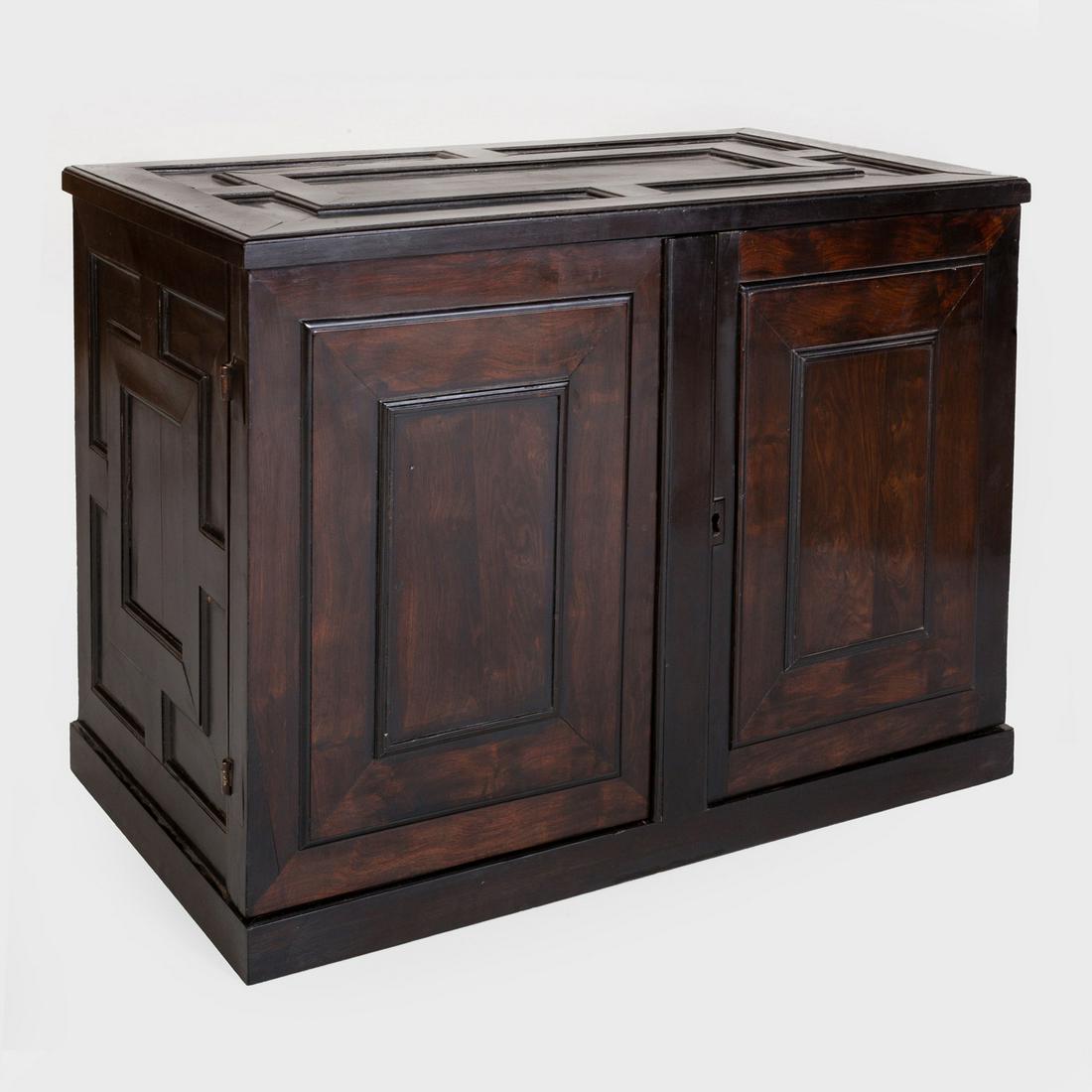 Fine Flemish Baroque Carved Ebony Cabinet: Fine Flemish Baroque Carved Ebony Cabinet The pair of doors opening to an architectural interior, fitted with a central door opening to a parquetry well, flanked by ten drawers, raised on a plinth bas