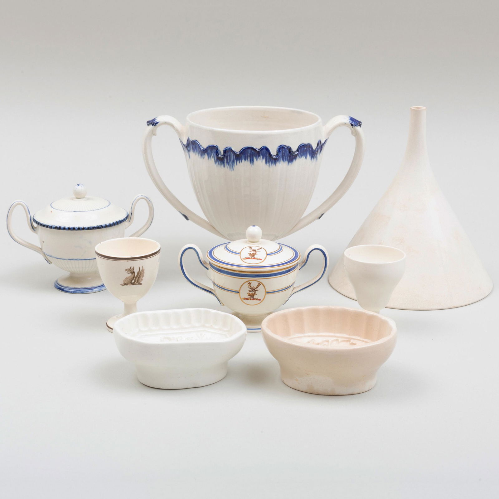 Group of Eight Wedgwood Creamware and Pearlwares: Group of Eight Wedgwood Creamware and Pearlwares Each with impressed mark; comprising a two-handled cup, a funnel, two small jelly molds, two egg cups (one with armorial), and two two-handled cups and