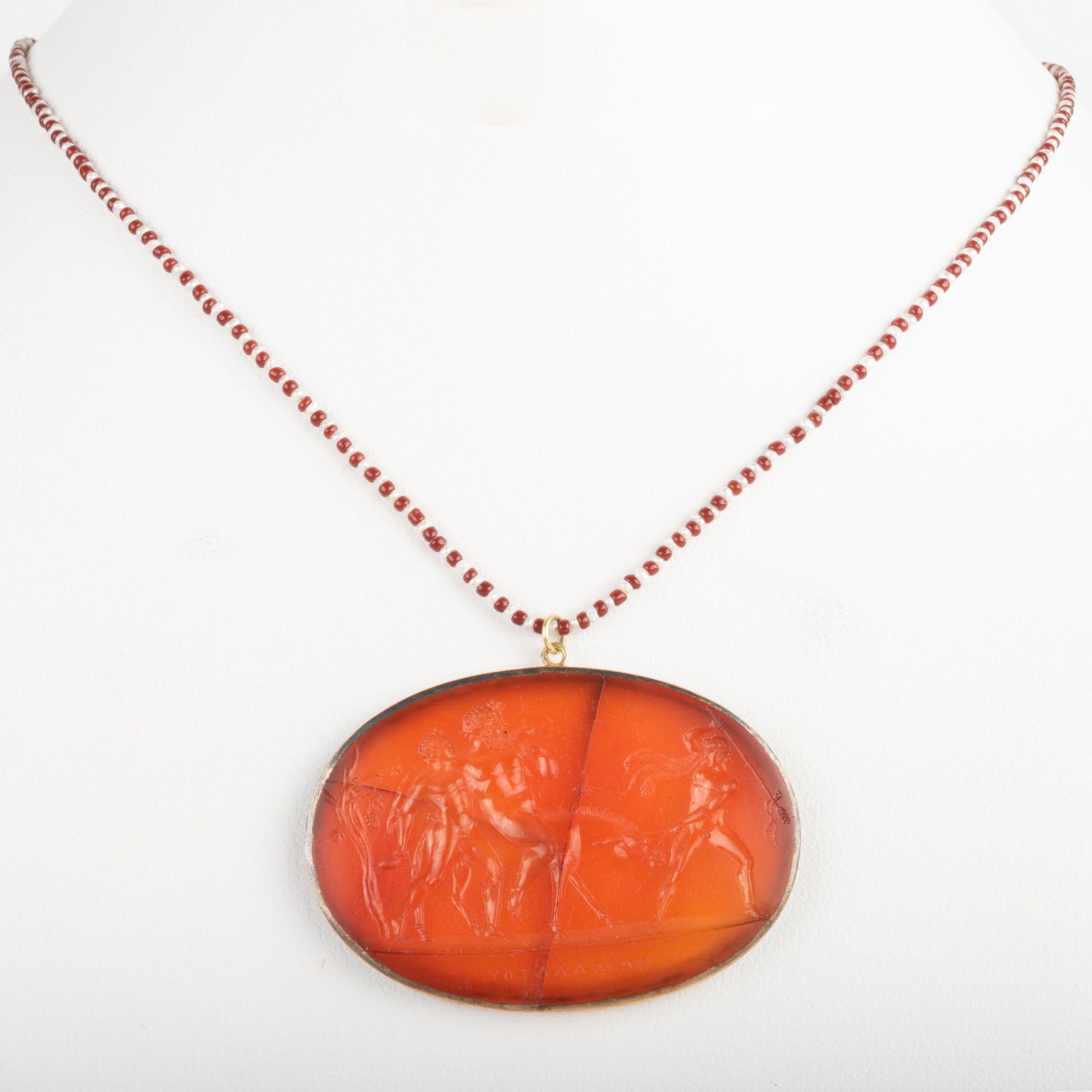 Neoclassical Carnelian Agate Intaglio of Selinus on a: Neoclassical Carnelian Agate Intaglio of Selinus on a Donkey with Dionysus Mounted in silver, on a beaded necklace. Intaglio: 1 1/4 x 1 3/4 in., necklace 17 in., 9.5 dwts. p> Prince Poniatowski, Polan