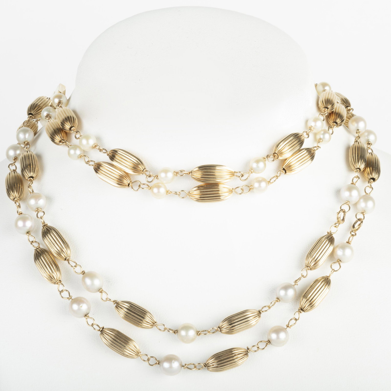 14k Gold Bead and Pearl Necklace and a Matching: 14k Gold Bead and Pearl Necklace and a Matching Bracelet Pearls measuring approx. 6.5mm. 31 in, 7 in., 24.9 dwts. p> Property form the Estate of Mrs. Stanley Krammer, Manhattan.