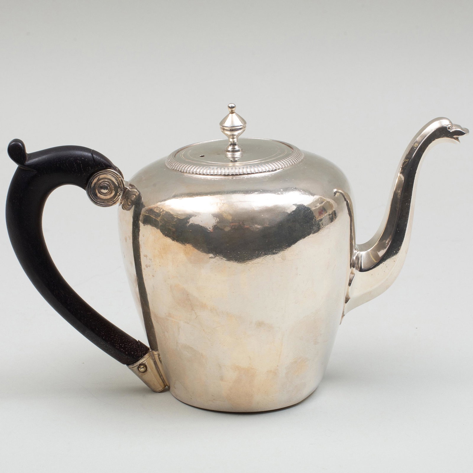 Early French Silver Tea Pot: Early French Silver Tea Pot Marked '.800' and probably for Paris; with ebonized wood handle. 8 1/4 in. wide (over handle), 15.2 oz. approx. gross weight. p> Property from the Estate of Mrs. C. Douglas