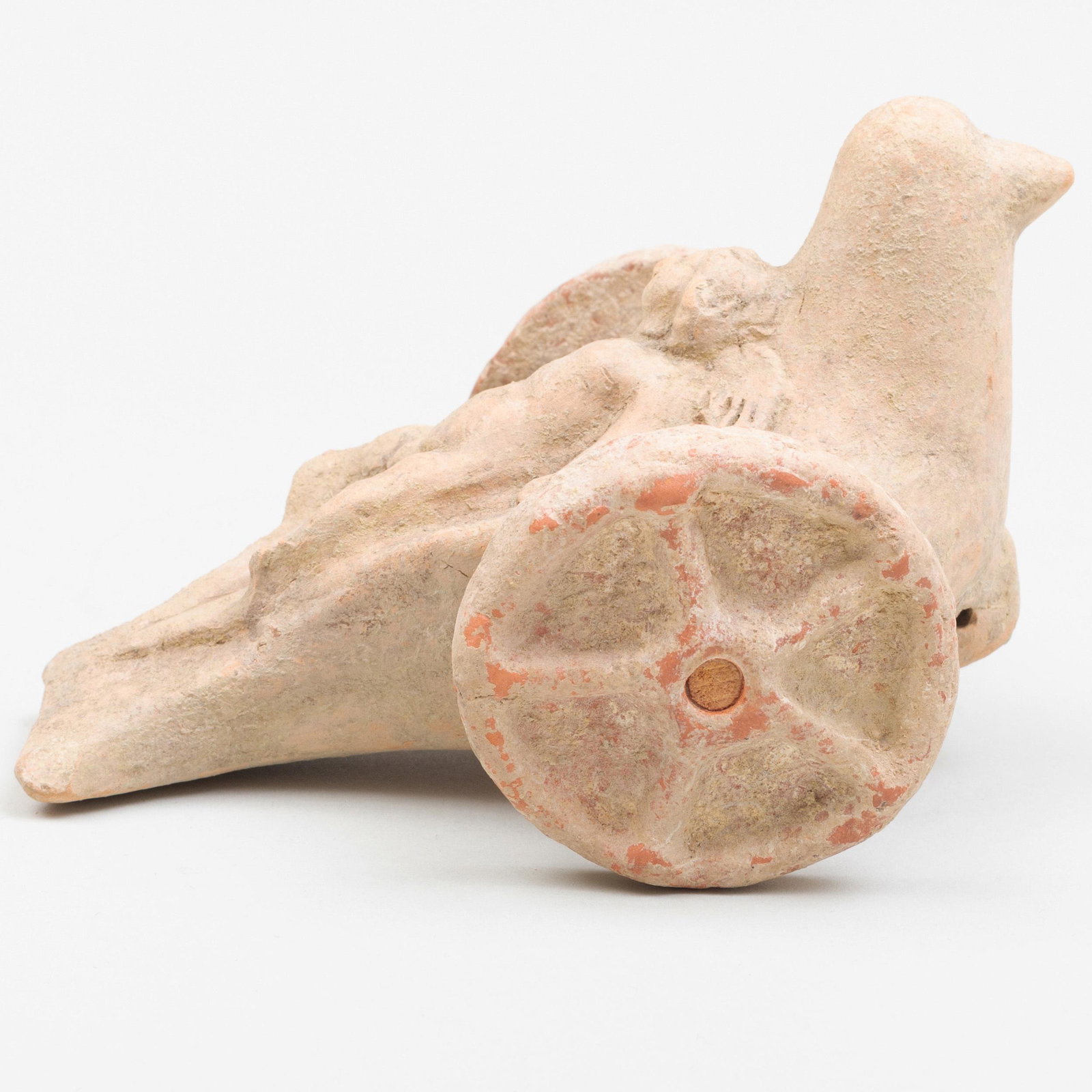 Greek Moulded Terracotta Dove-Shaped Chariot Child's: Greek Moulded Terracotta Dove-Shaped Chariot Child's Toy With a reclining putti. 3 3/4 x 4 x 6 1/8 in. p> Property from the Estate of Martin and Faith-Dorian Wright