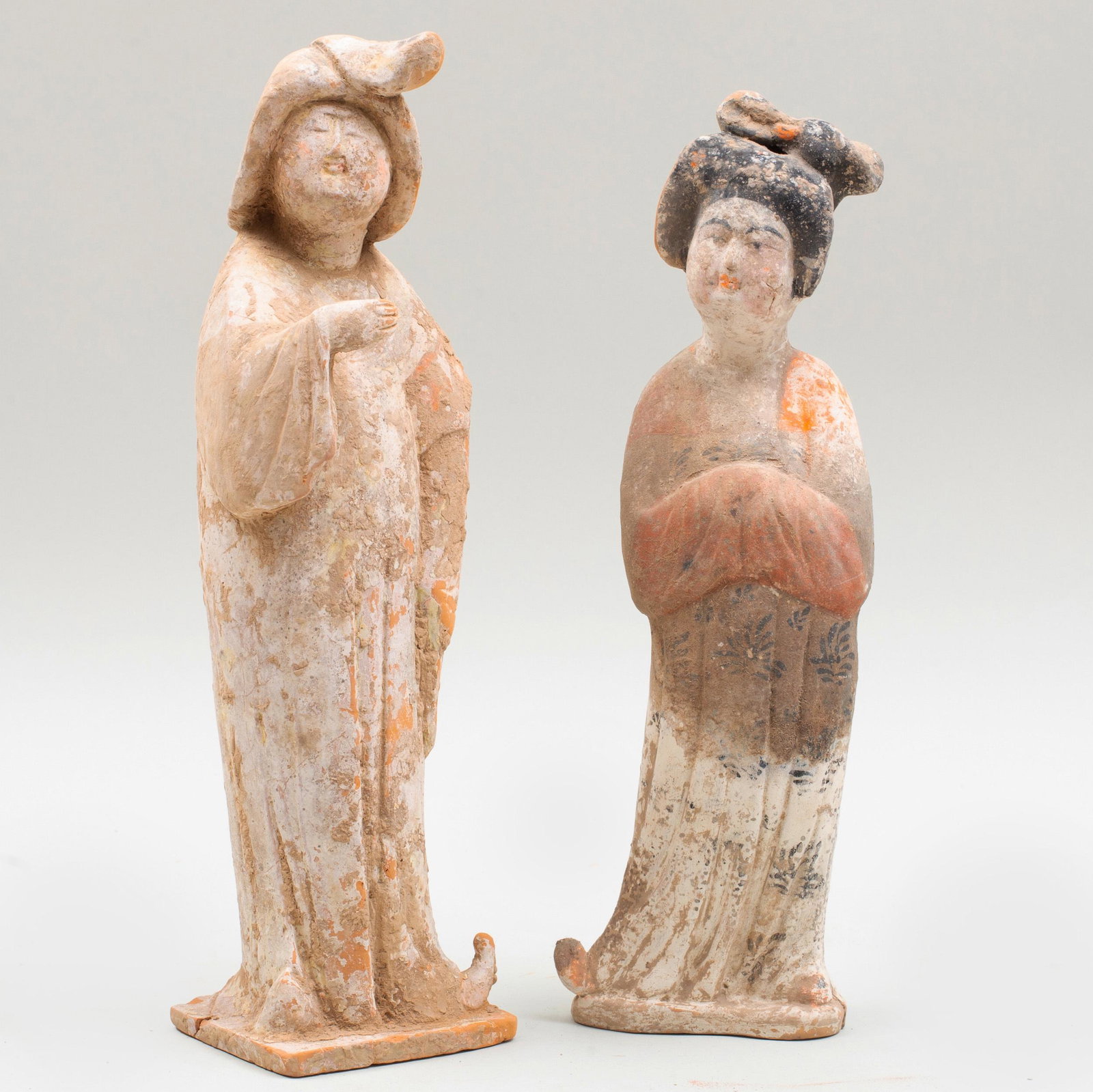 Two Chinese Painted Pottery Figures of Court Ladies: Two Chinese Painted Pottery Figures of Court Ladies The larger 13 3/4 in. high. p> Private Collection of Mr. P. Wong, Elegance Gallery, Hong Kong, 1993. Property from a Private Collector, Chatham, NY