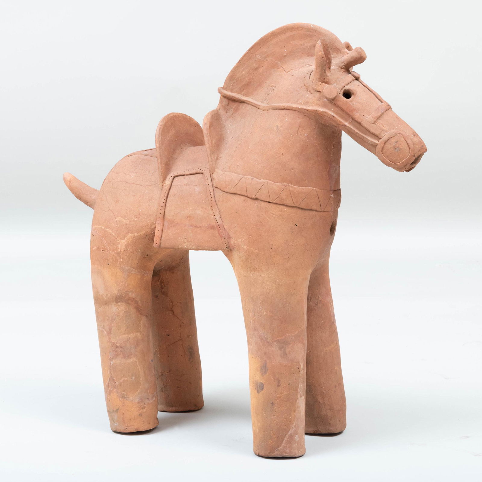 Large Japanese Haniwa Figure of a Horse, Late Kofun: Large Japanese Haniwa Figure of a Horse, Late Kofun Period Of low-fired red clay, standing four square on long columnar legs, the face directed forward and equipped with cheek guards and a bridle affi