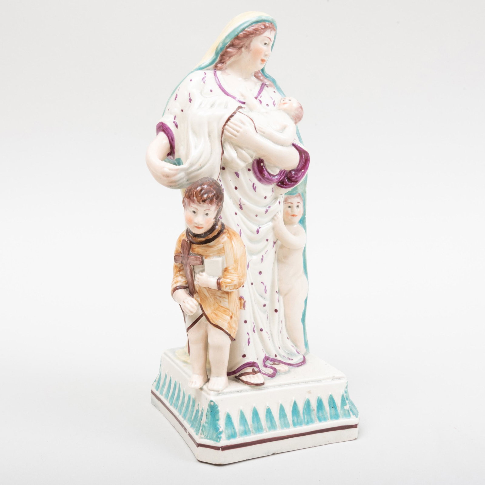 Staffordshire Pearlware Figure of Charity: Staffordshire Pearlware Figure of Charity 9 1/4 in. high. p> Label for Seidenberg Antiques, NY. Property from a Distinguished New York City Collector