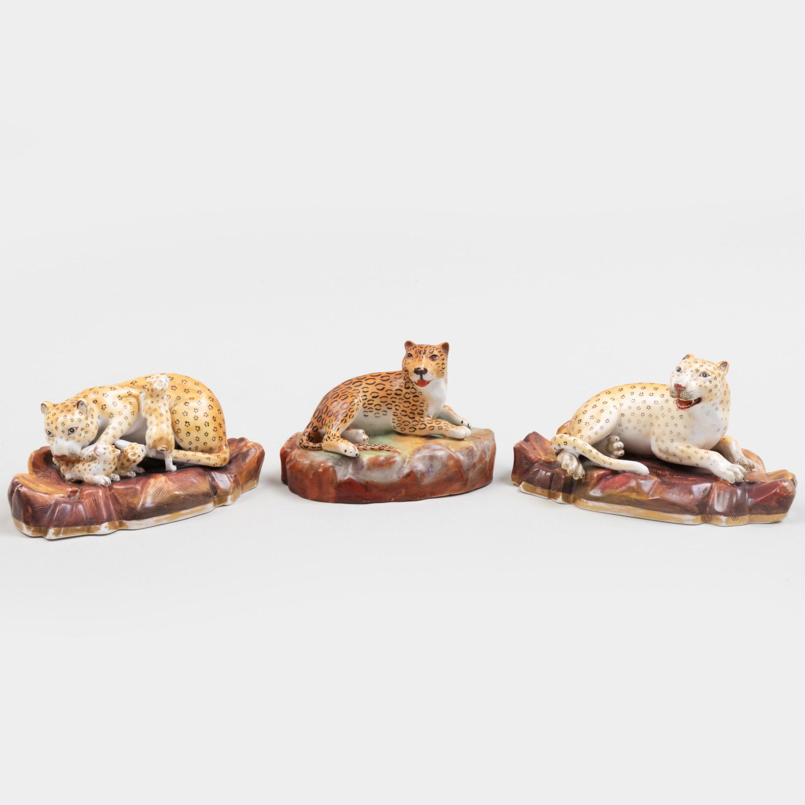 Jacob Petit Porcelain Model of a Recumbent Leopard and: Jacob Petit Porcelain Model of a Recumbent Leopard and a Pair of Continental Porcelain Leopards The Jacob Petit example with a partial blue JP mark. The largest 5 in. wide. p> Property from a Distingu