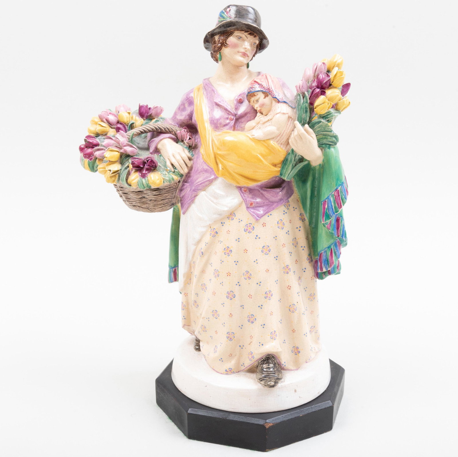 Charles Vyse Chelsea Pottery 'The Tulip Woman': Charles Vyse Chelsea Pottery 'The Tulip Woman' Painted artist's intersecting 'CV' monogram, 'Chelsea' and dated 1924; on ebonized wood base. The figure 10 1/4 in. high. p> Property from a Distinguishe