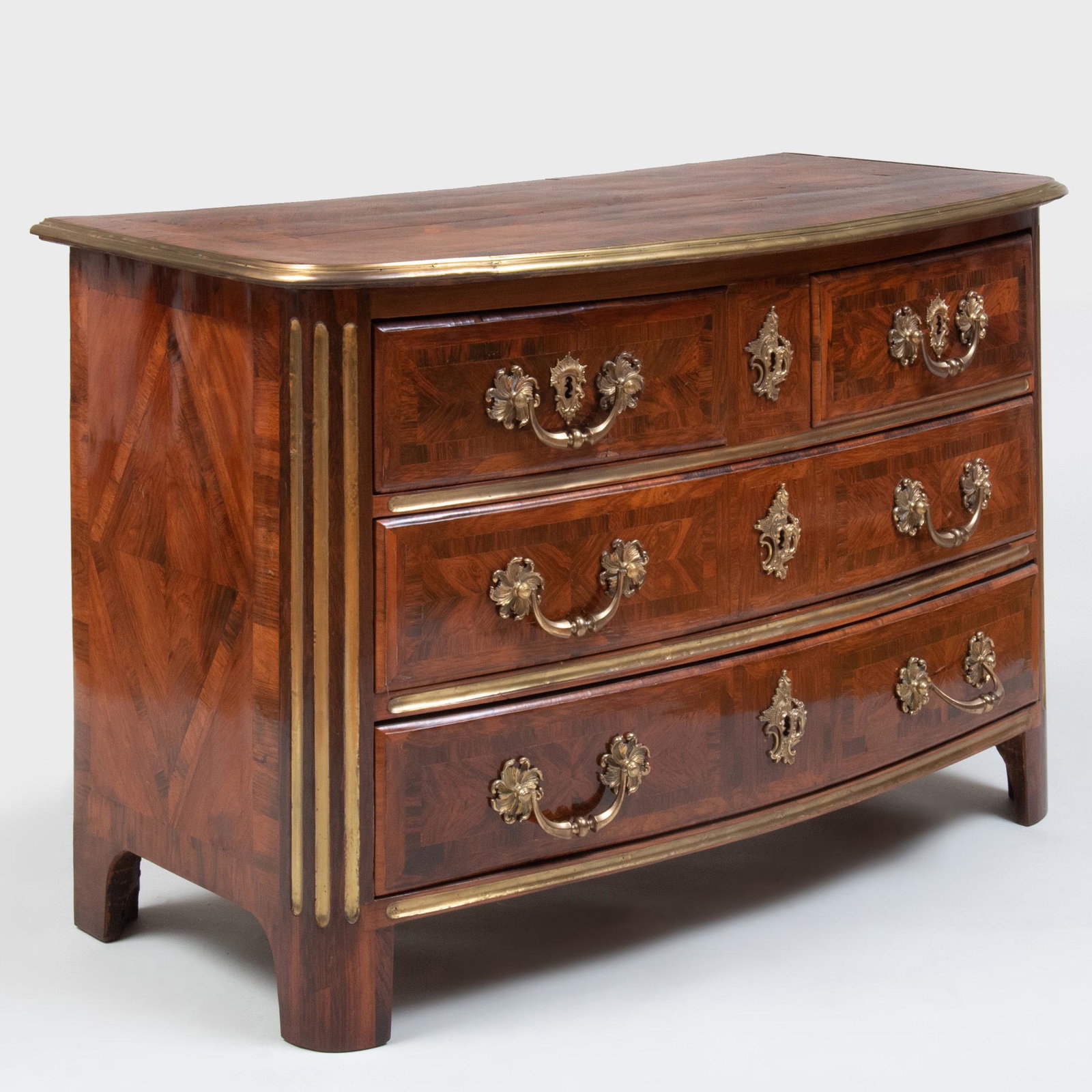 Régence Ormolu-Mounted Kingwood Parquetry Commode: Régence Ormolu-Mounted Kingwood Parquetry Commode Fitted with two short over two long drawers, raised on block feet. 32 1/2 x 51 1/2 x 25 1/2 in. p>