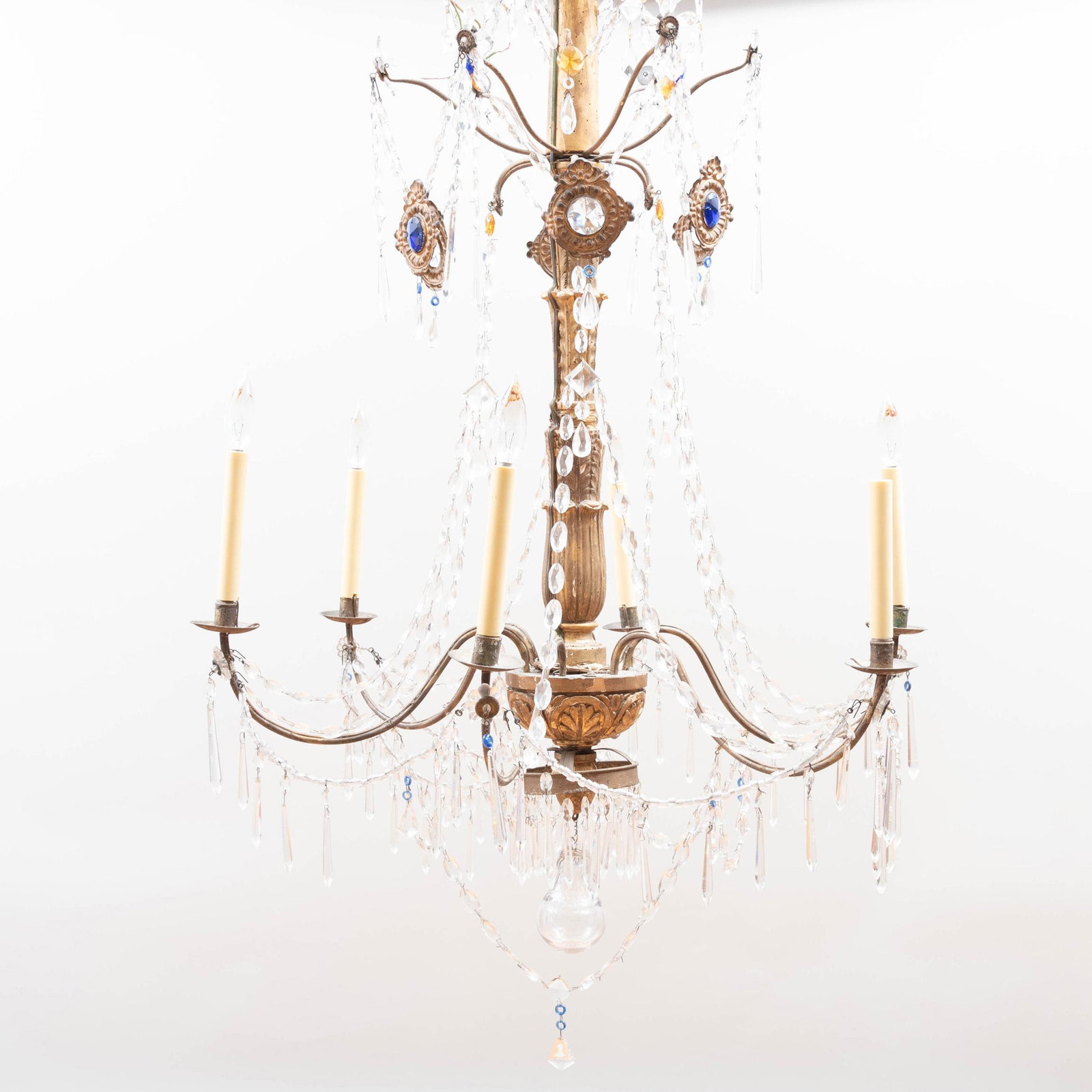 Pair of Italian Giltwood and Glass Six-Light: Pair of Italian Giltwood and Glass Six-Light Chandeliers Each fitted with gilt-metal plaques centered by blue and clear glass, the whole fitted with beaded swags and pendant drops and terminating in a