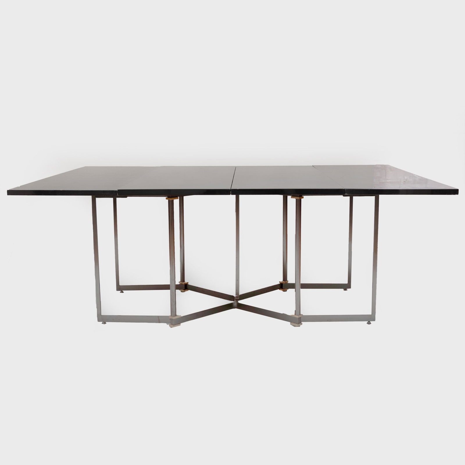 Maison Jansen Parcel-Gilt Brushed-Metal and Lacquer: Maison Jansen Parcel-Gilt Brushed-Metal and Lacquer Extension Dining Table With two leaves and accordion mechanism, folds into a console table. Console 29 1/2 x 55 x 19 in., dining table 29 x 38 x 55