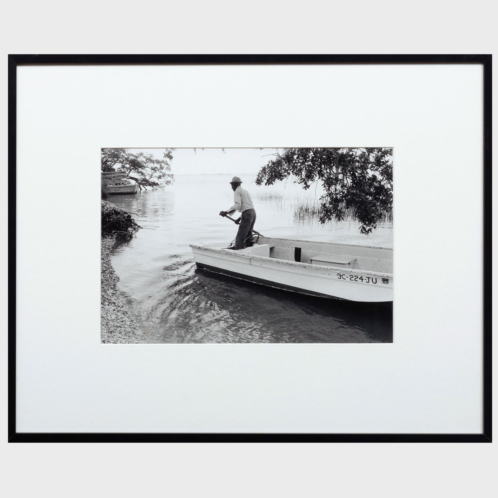 Jeanne Moutoussamy-Ashe (b. 1951): Jake and his Boat: Jeanne Moutoussamy-Ashe (b. 1951): Jake and his Boat Arriving on Daufuskie's Shore Gelatin silver print, 1978, signed and inscribed 'For my dear friend Henry with appreciation and admiration' on the b