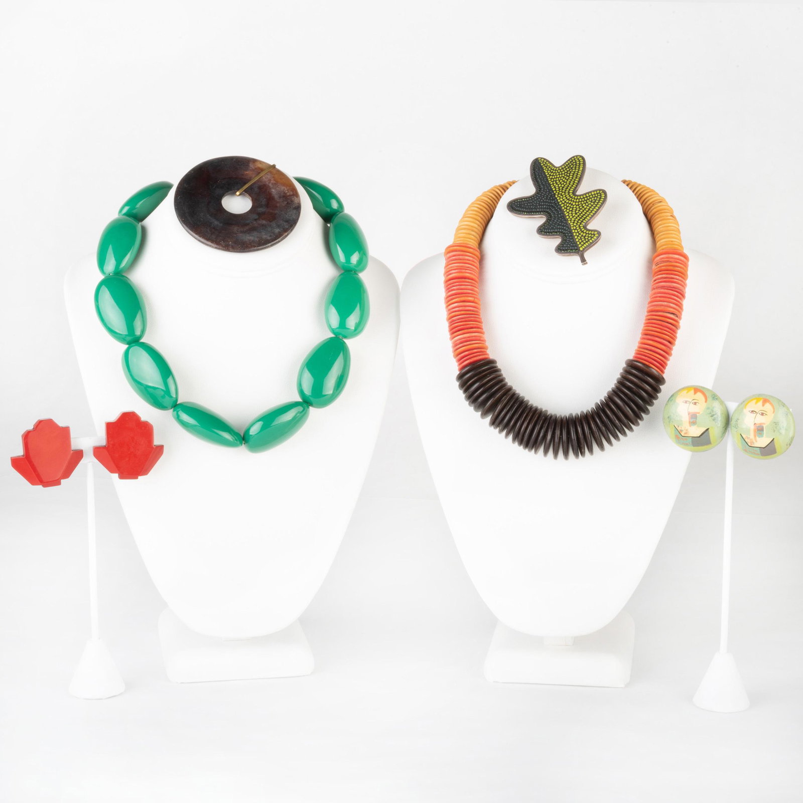 Miscellaneous Group of Jewlery: Miscellaneous Group of Jewlery Including a wooden beaded necklace; a plastic beaded necklace; two pairs of earrings; a pendant; and a Kanda silver brooch, signed 'Kanda' and marked '.925'. Necklace 24