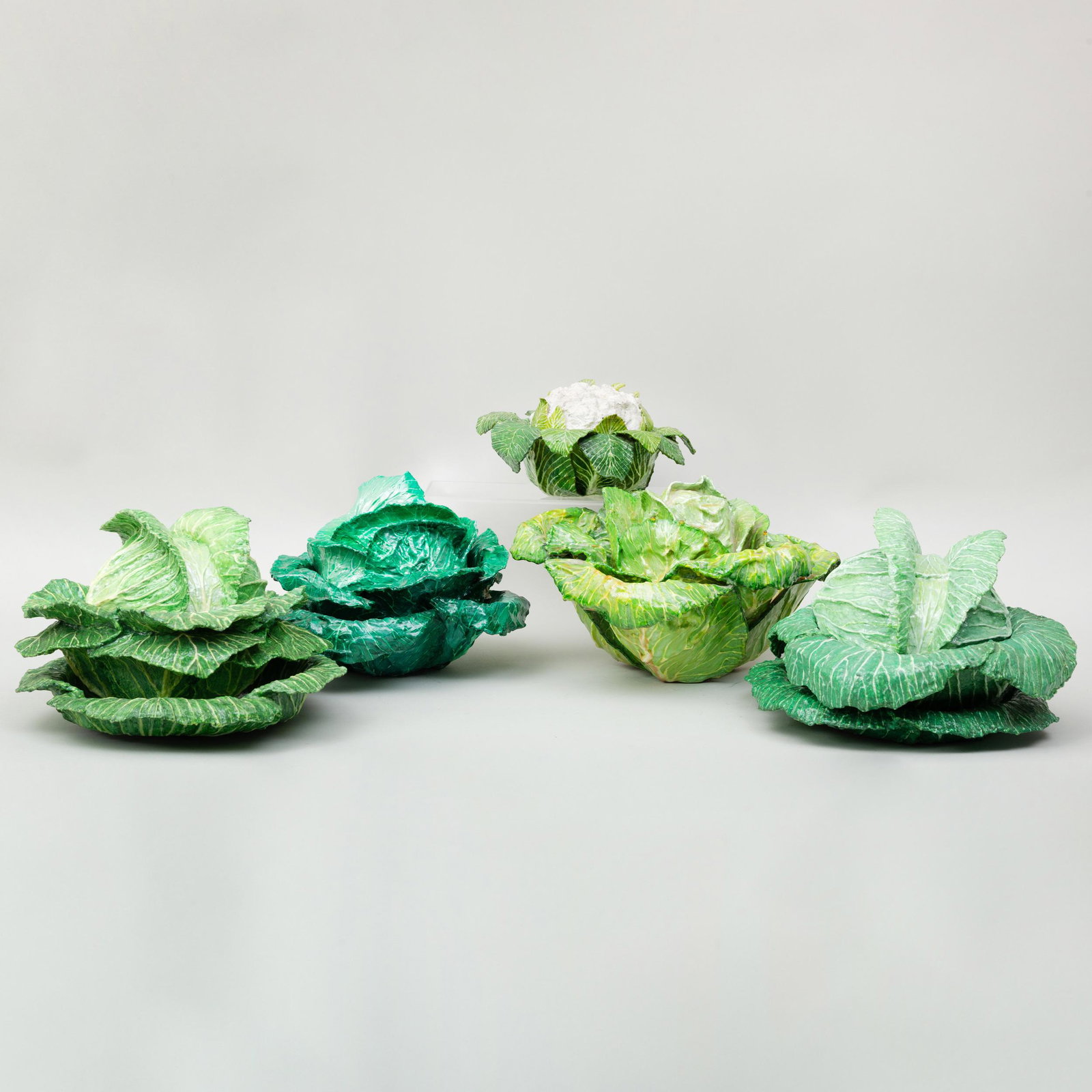 Group of Four Papier Mâché Models of Cabbage, and One: Group of Four Papier Mâché Models of Cabbage, and One Model of Cauliflower Each of the cabbages with covers, two of the cabbages with underplates. The largest 8 in. high.