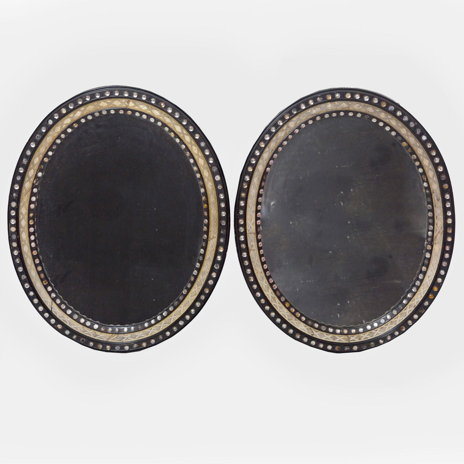 Pair of Irish Ebonized Parcel-Gilt and Beaded Glass: Pair of Irish Ebonized Parcel-Gilt and Beaded Glass Oval Mirrors 31 1/2 x 25 1/2 in.