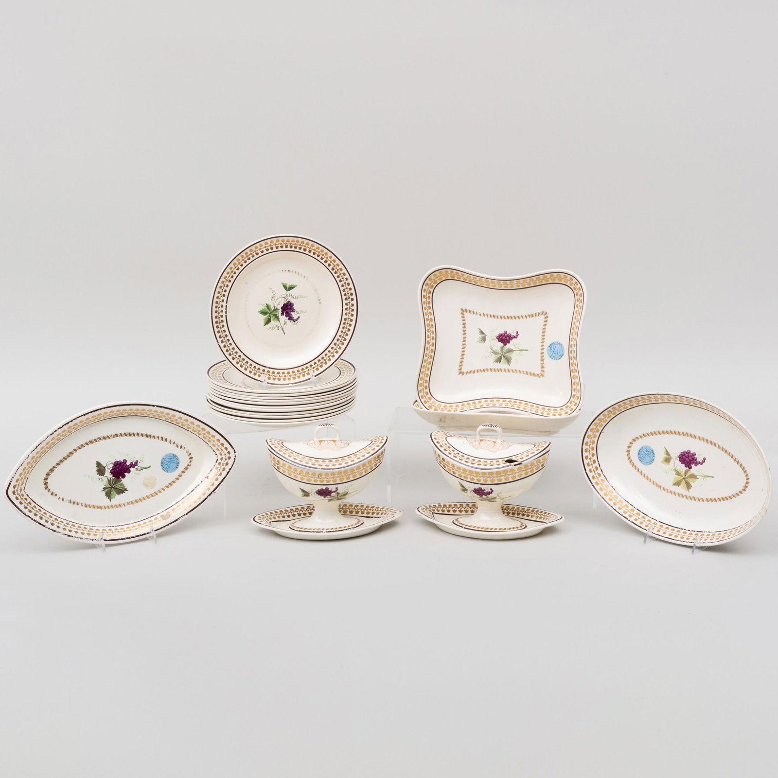 English Creamware Part Dessert Service Decorated with a: English Creamware Part Dessert Service Decorated with a Grape Vine, Probably Leeds Comprising: A pair of sauce boats and covers on stands An oval saucer dish A shallow navette dish A pair of shaped sq