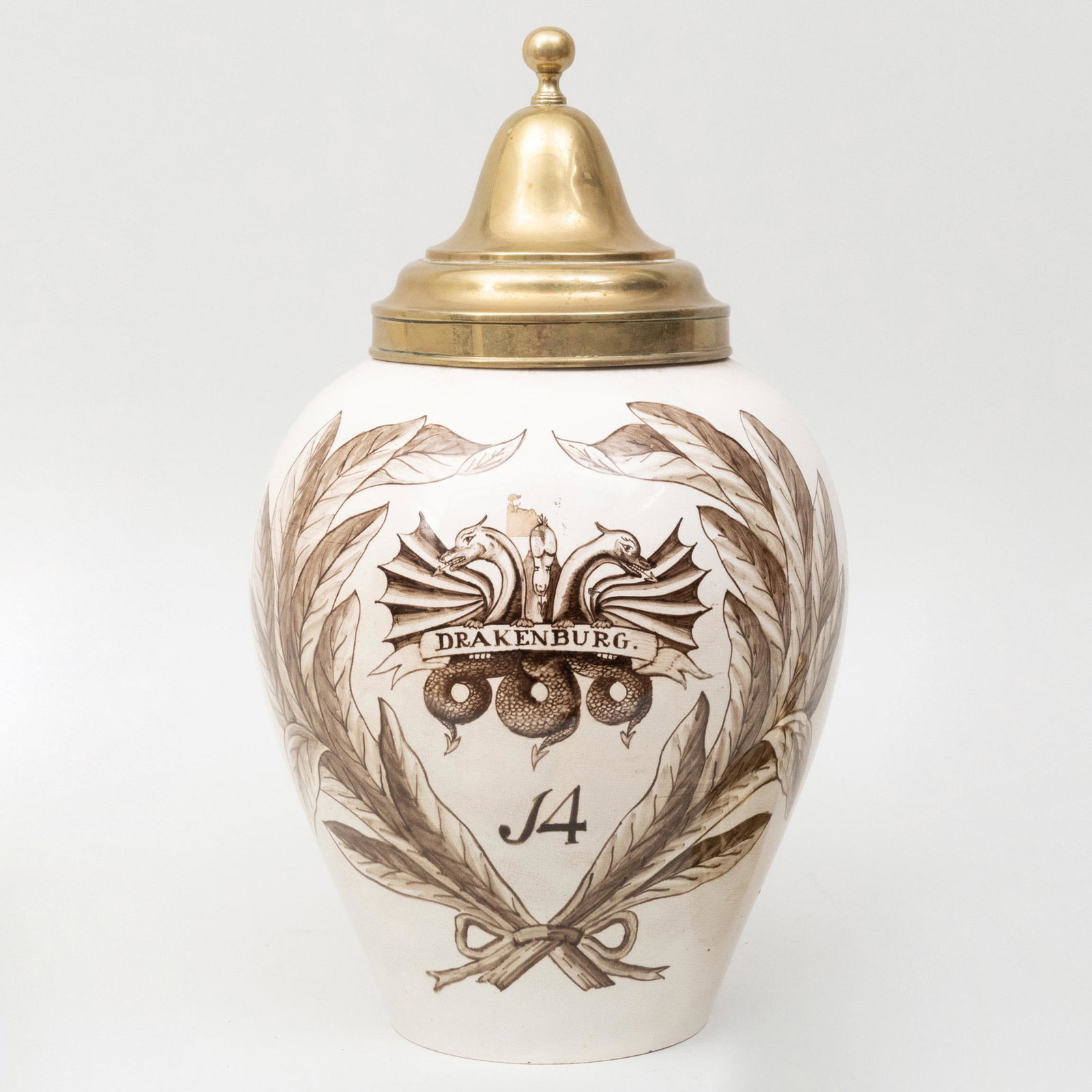 Dutch Pottery Tobacco Jar with Brass Cover: Dutch Pottery Tobacco Jar with Brass Cover Together with an additional brass cover. The jar 11 1/4 in. high, the jar and cover 16 1/2 in. high.