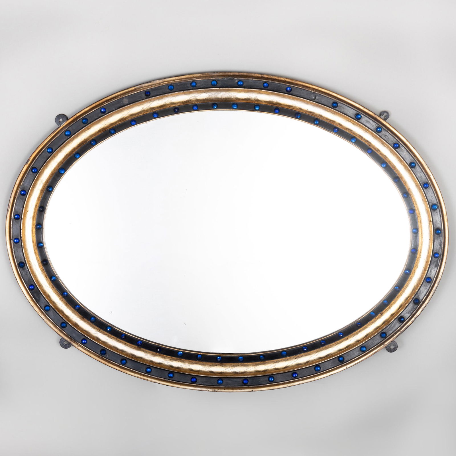 Large Irish Ebonized Parcel-Gilt and Blue Glass Oval: Large Irish Ebonized Parcel-Gilt and Blue Glass Oval Mirror 36 1/2 x 26 1/2 in.