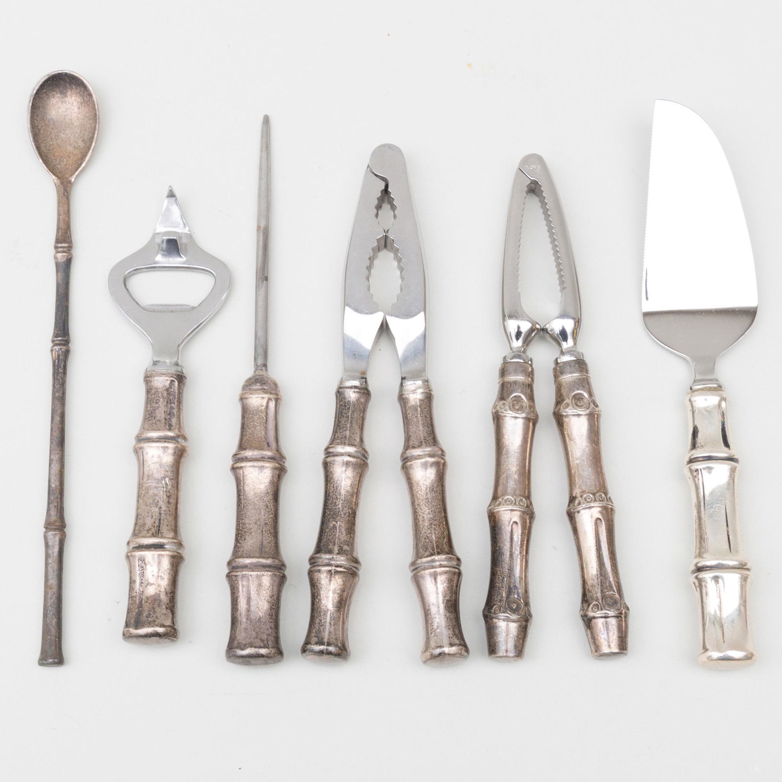 Group of Tiffany Silver Faux Bamboo Bar Tools: Group of Tiffany Silver Faux Bamboo Bar Tools Each marked 'Sterling'. Comprising: A stirring spoon An ice pick with steel prong A cheese knife with steel blade A bottle opener with steel key A nut cra